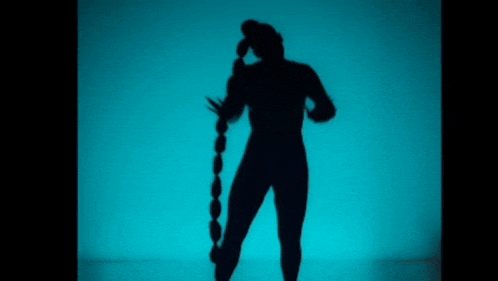 a silhouette of a person talking on a cell phone