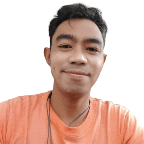 a man wearing an orange shirt and headphones smiles for a picture