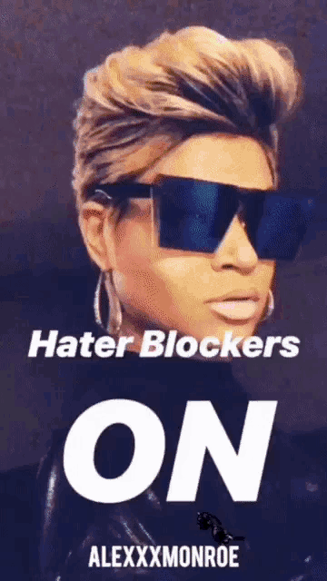 a poster of a woman wearing sunglasses and the words hater blockers on