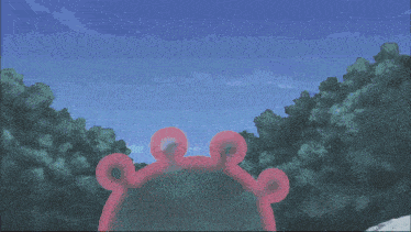 a man stands in front of a large pink sphere