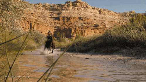 a photo of a man riding a horse in a river with a caption that says horizon american saga