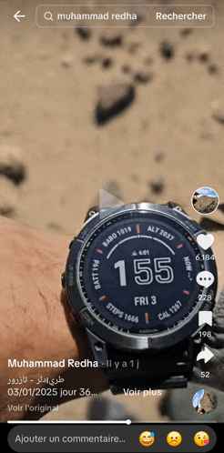a person is wearing a watch that says 155 on the face