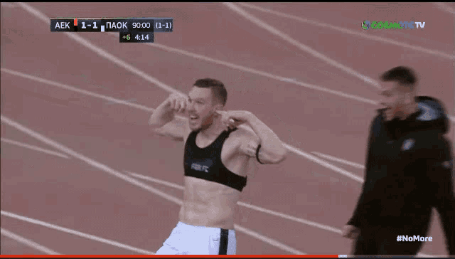 a group of soccer players are celebrating a goal against aek