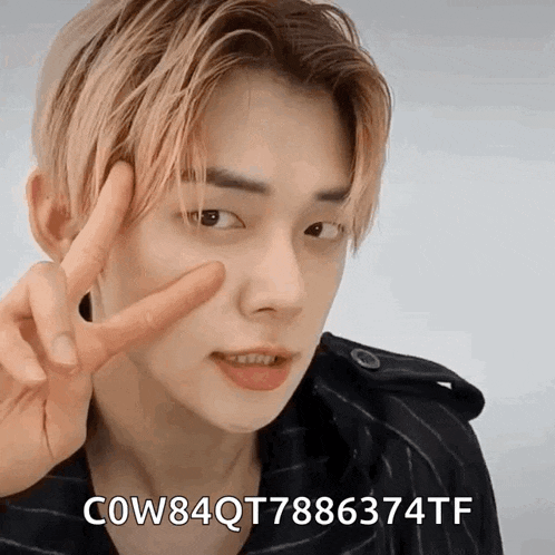 a close up of a person giving a peace sign with cow84qt7886374tf written below them