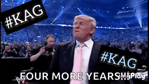 a man in a suit and tie stands in front of a crowd and says #kag four more years !!
