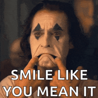 joker making a face with the words smile like you mean it below him