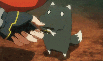 a person is petting a small cartoon character with a fox tail