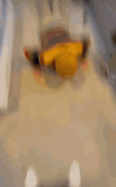 a person wearing a yellow hat is doing push ups