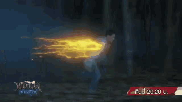 a man in a blue shirt is running through a forest