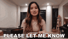 a woman says please let me know while holding a tablet
