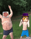 a man with a s on his head stands next to a boy with a purple top hat
