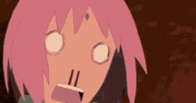 a cartoon girl with pink hair is making a funny face .