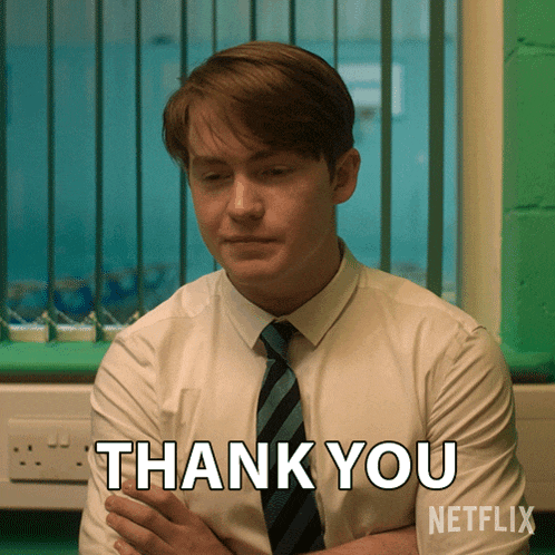a man in a suit and tie says thank you