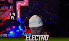 a man wearing a hard hat is sitting in front of a microphone in a video game .