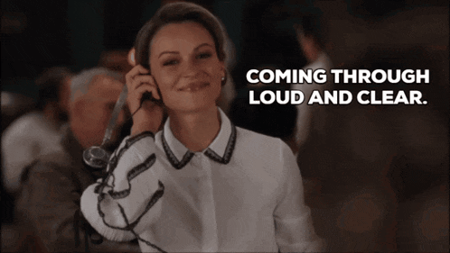 a woman talking on a phone with the words " coming through loud and clear " below her