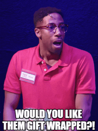 a man in a pink shirt says would you like them gift wrapped ?