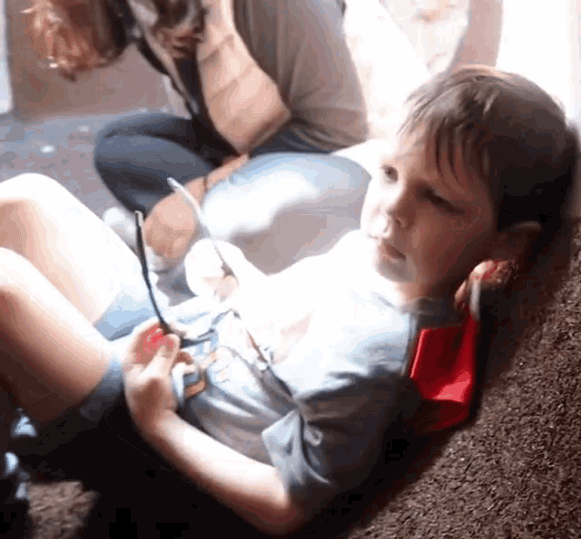 a young boy wearing a superhero cape and glasses