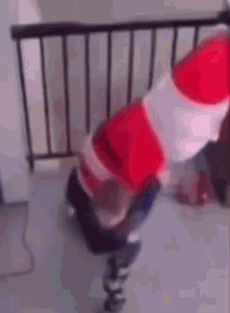 a person in a santa claus costume is standing on a trampoline .