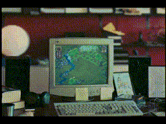 a computer monitor with a map on the screen and a keyboard