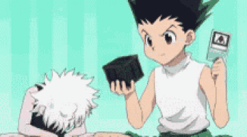 a couple of cartoon characters are sitting next to each other and one of them is holding a box .