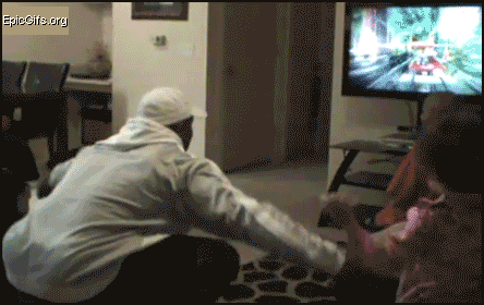 a man is squatting down in front of an epicgifs.org screen