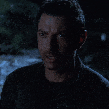 a close up of a man 's face with a serious look on his face