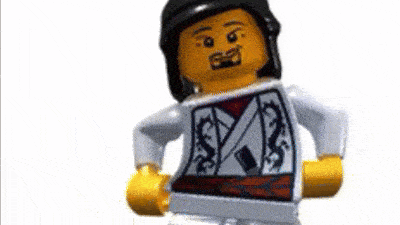 a lego figure is wearing a white shirt with a dragon on it and a black hat .