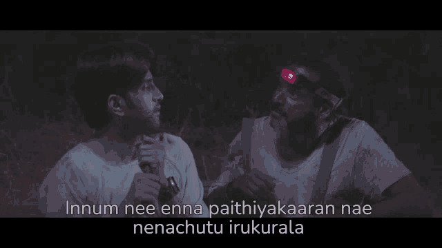 a man with a red headlight on his head is talking to another man