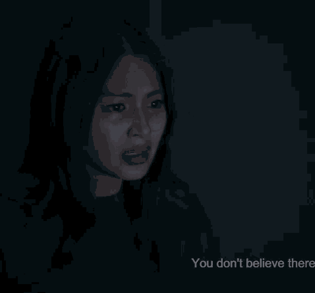 a woman in a dark room with the words you don t believe there below her