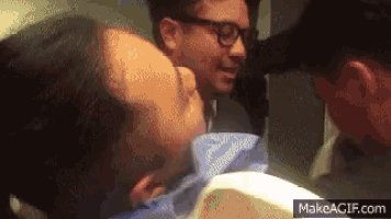 a gif of a man being shaved with the url makeagif.com