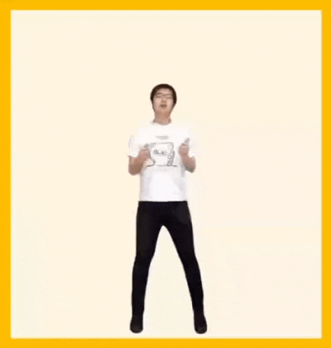 a man in a white t-shirt and black pants is dancing .