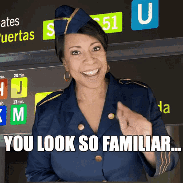 a stewardess says you look so familiar in front of a sign