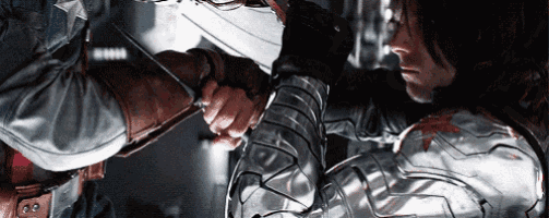 captain america and the winter soldier are shaking hands in a movie scene .