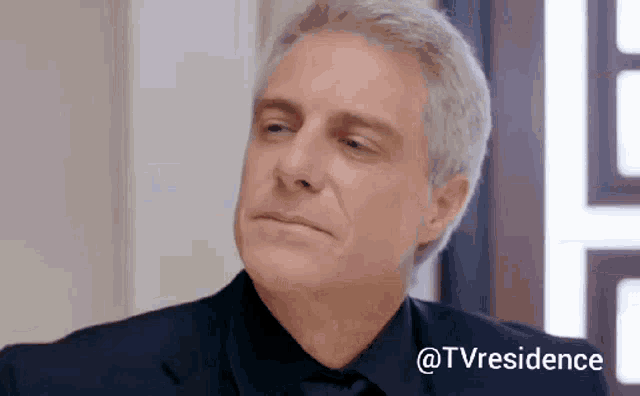 a close up of a man 's face with the words " @tvresidence " below him