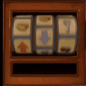 a slot machine is spinning in a wooden box with icons on it .