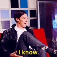 a man is sitting on a couch with his legs crossed and says i know