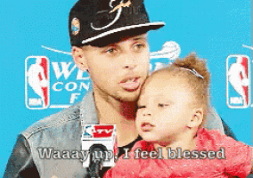 a man holding a little girl with the words waaaay up i feel blessed on the bottom
