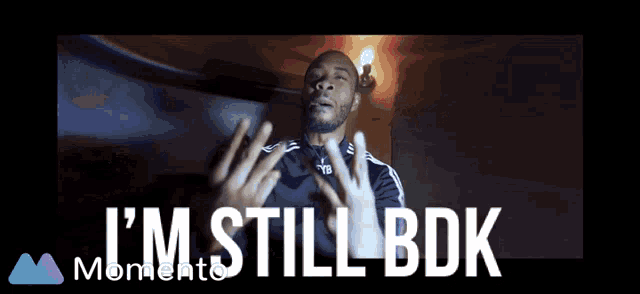 a man says i 'm still bdk with his hands in the air