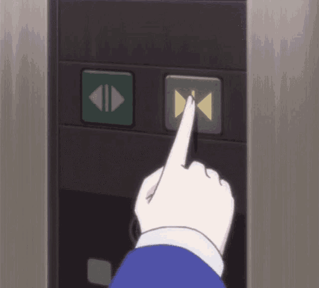 a person is pointing at a button that says ' up ' on it