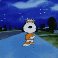 a cartoon of snoopy wearing a headband is standing on a sidewalk