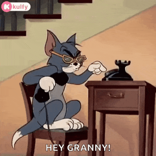a cartoon cat is sitting on a chair talking on a telephone and saying hey granny .
