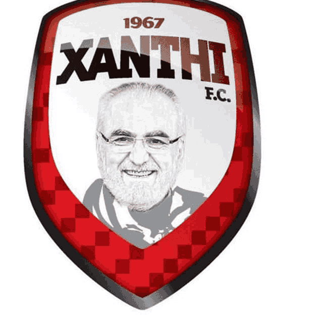a logo for xanthi f.c. shows a man with a beard