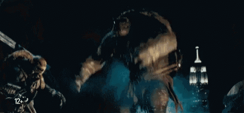 a blurred image of a movie scene with the number 12 on the bottom right corner