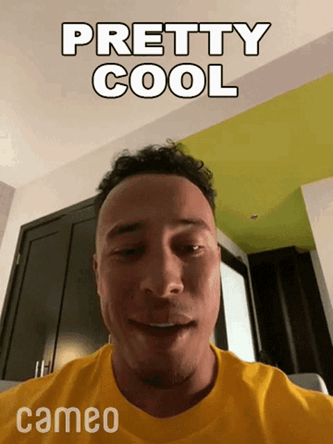 a man in a yellow shirt is smiling and says pretty cool cameo