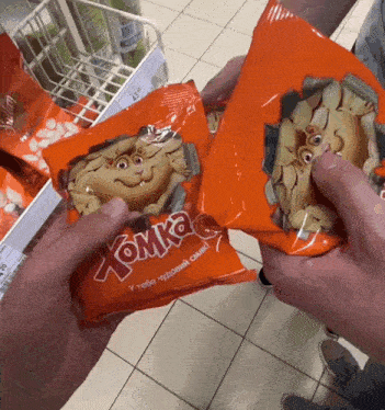 a person holding a bag of tonka candy