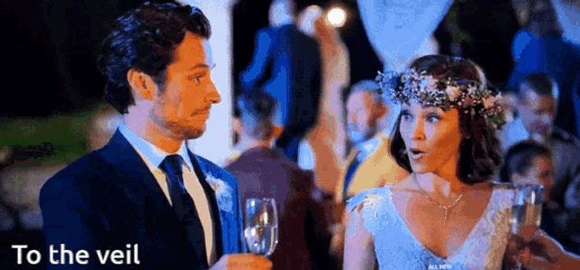 a bride and groom are toasting with champagne at their wedding reception