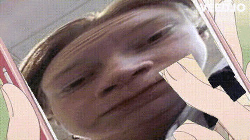 a close up of a person taking a selfie on a cell phone with video written on the bottom