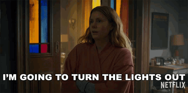 a woman in a robe says " i 'm going to turn the lights out "