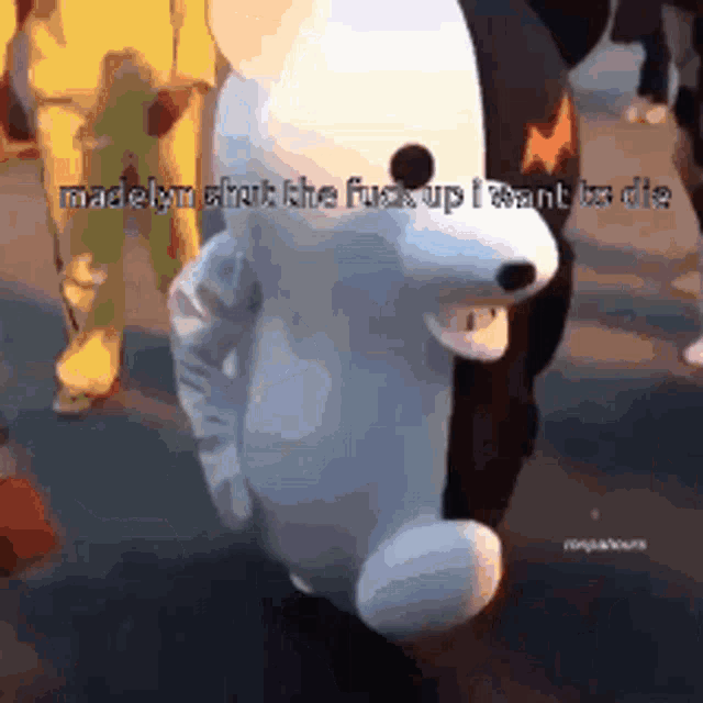 a stuffed animal with the words madelyn shut the fuck up i want to die written on it