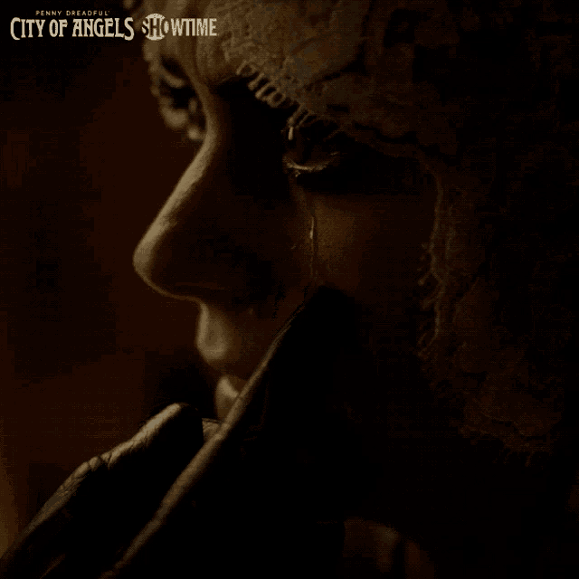 penny dreadful city of angels showtime poster with a woman 's face